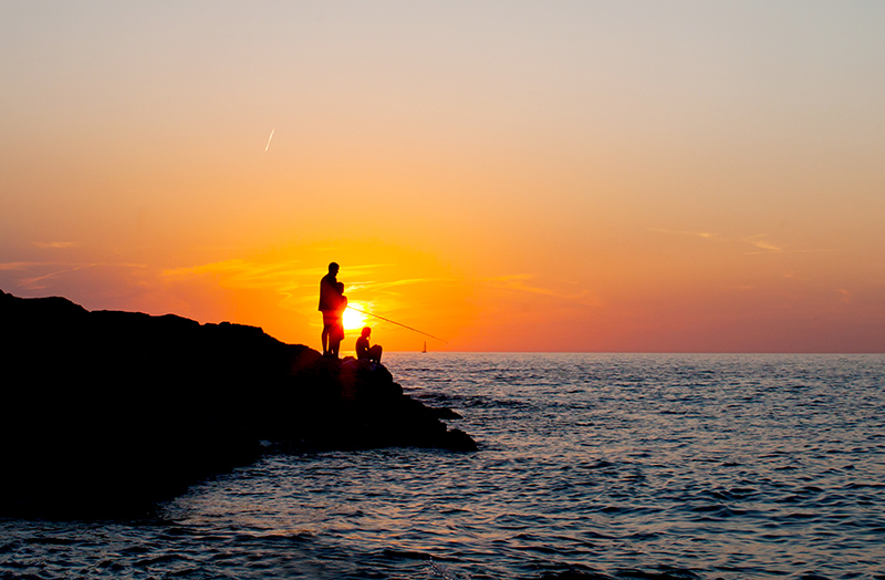 Man fishing at the sea